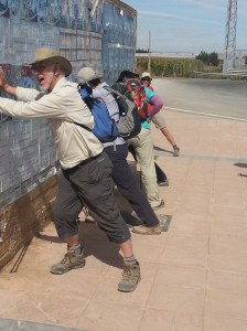 Fr Joe Taylor and others doing stretches during a break