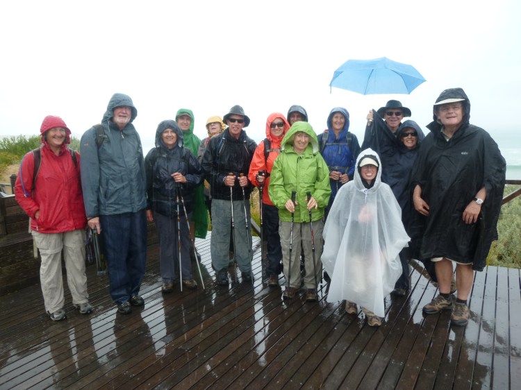 The group in the pouring  rain