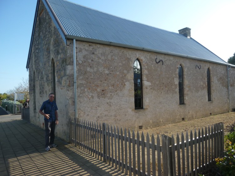 Larry outside of Mary McKillop's school in Penola